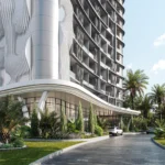 ทางเข้า Le Kamala กับฟาซาดโค้งและ Vertical Parametric Fins ที่ได้แรงบันดาลใจจากประกายแสงบนยอดคลื่น